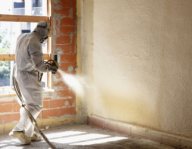 employee painting a wall